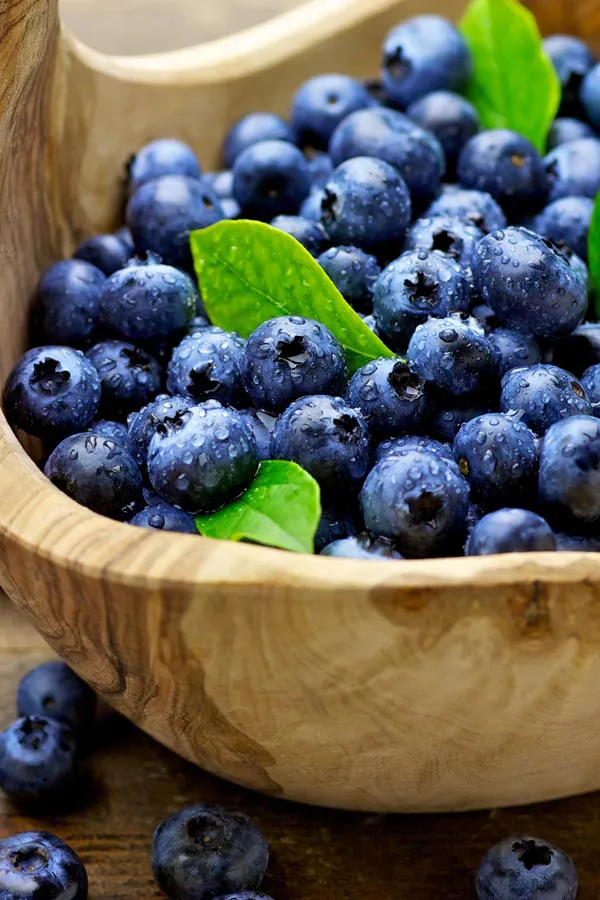 IV-Therapy-Treatment A bowl of refreshing, nourishing blueberries in a wooden bowl, representing IV therapy from Proactive Wellness Centers in Loudoun County.