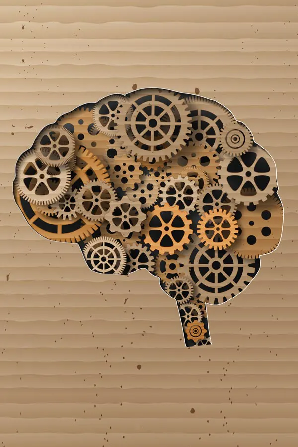 Neurodegenerative-Disorders-Treatment An illustration of a brain cut out of cardboard, with wooden cogs inside, representing neurodegenerative diseases treated by Proactive Wellness Centers in Loudoun County.