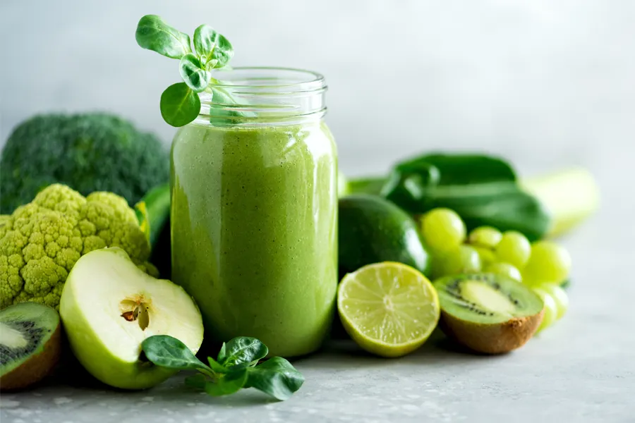Nutritional-Counseling-Clinic A tableau of healthy green fruits and vegetables and juices. Get nutritional counseling from Proactive Wellness Centers in Loudoun County.