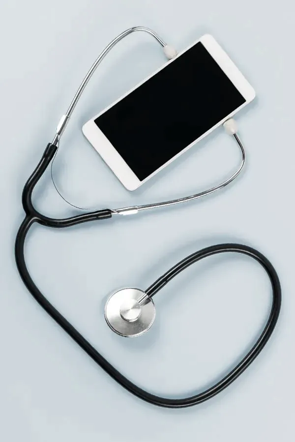 Telemedicine-Treatment A smartphone with a stethoscope attached to it, symbolizing Telemedicine treatment from Proactive Wellness Centers in Loudoun County.